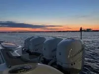  Yacht Photos Pics 2020 Invincible 37' Catamaran at sunset with four outboard engines.