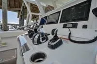  Yacht Photos Pics Control panel of a 2020 Invincible 37' Catamaran with advanced navigation systems.