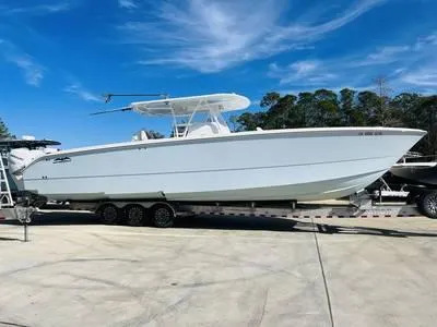  Yacht Photos Pics 2020 Invincible 37' Catamaran on trailer under clear blue sky.