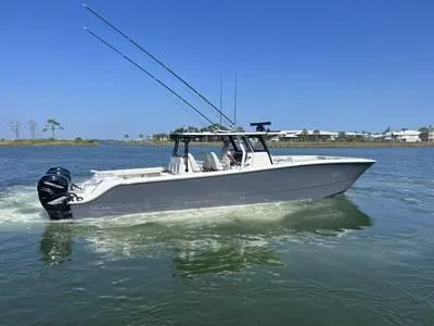  Yacht Photos Pics 2020 Invincible 37' Catamaran cruising on a sunny day.