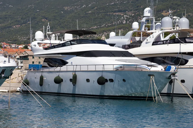  Yacht Photos Pics Luxury 2008 Maiora 20S yacht docked in a marina, surrounded by other boats.