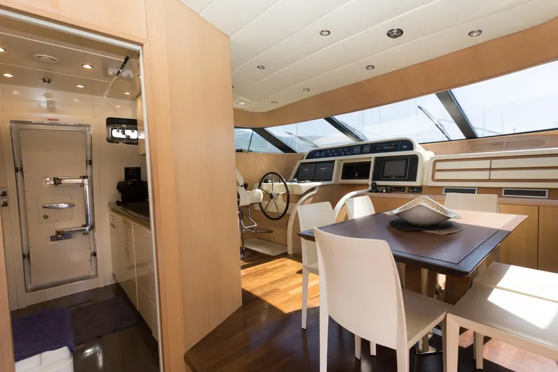  Yacht Photos Pics Luxurious interior of 2008 Maiora 20S yacht with modern dining and navigation area.