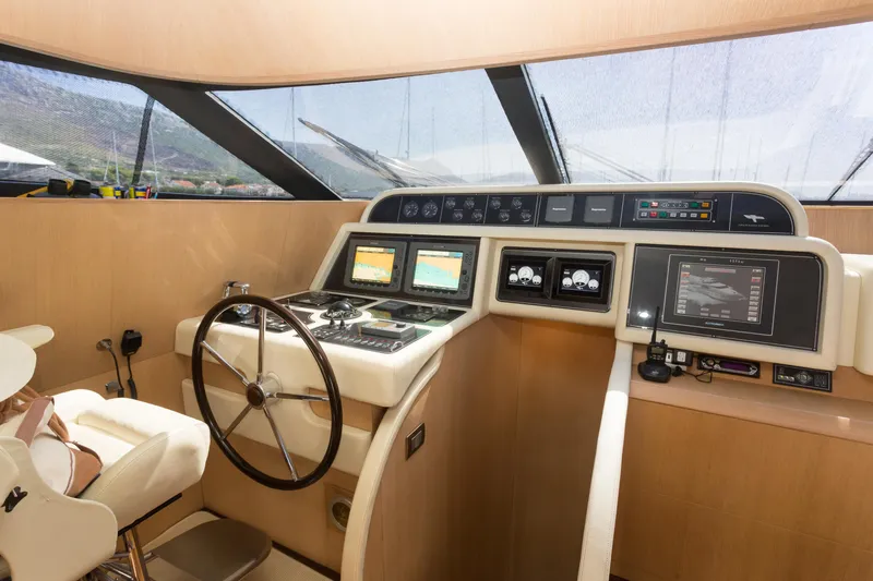  Yacht Photos Pics Helm of 2008 Maiora 20S yacht with modern navigation equipment and steering wheel.