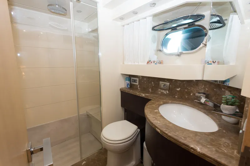  Yacht Photos Pics Luxurious bathroom in 2008 Maiora 20S yacht with marble countertop and modern shower.