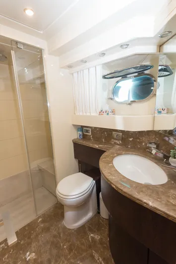  Yacht Photos Pics Luxurious bathroom in 2008 Maiora 20S yacht with marble countertop and shower.