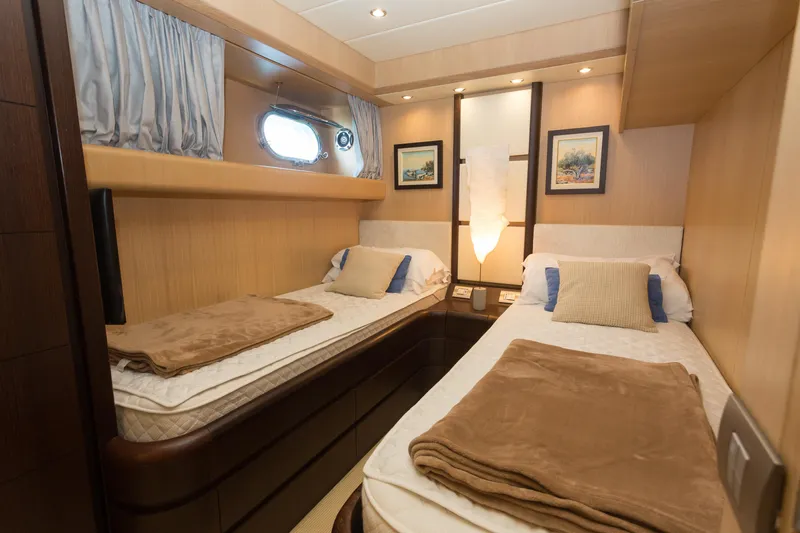  Yacht Photos Pics Luxurious twin cabin interior of 2008 Maiora 20S yacht with elegant decor.