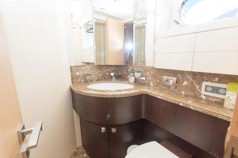  Yacht Photos Pics Luxurious bathroom in 2008 Maiora 20S yacht with marble countertop and modern fixtures.