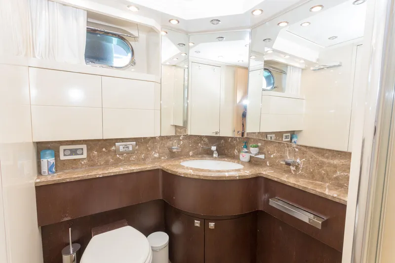  Yacht Photos Pics Luxurious bathroom in 2008 Maiora 20S yacht with marble countertop and modern fixtures.