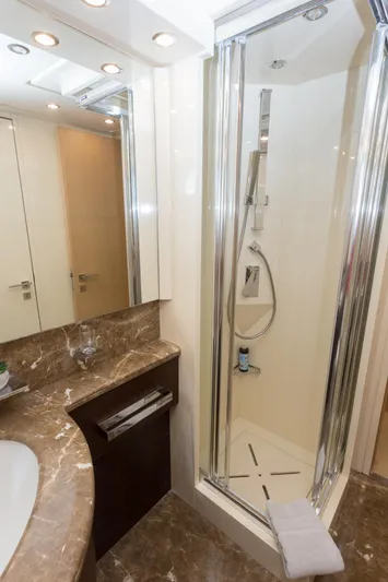  Yacht Photos Pics Luxurious bathroom in 2008 Maiora 20S yacht with marble countertop and modern shower.