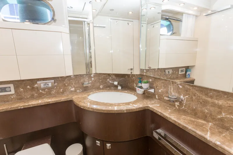  Yacht Photos Pics Luxurious bathroom in 2008 Maiora 20S yacht with marble countertop and modern fixtures.