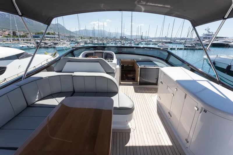  Yacht Photos Pics Luxurious 2008 Maiora 20S yacht interior with elegant seating and marina view.