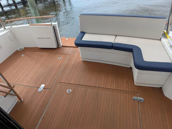  Yacht Photos Pics 2019 Beneteau Swift Trawler 44 deck with seating and wooden flooring.