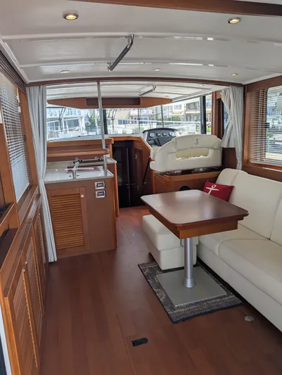  Yacht Photos Pics Interior of 2019 Beneteau Swift Trawler 44, featuring elegant wood finishes and modern amenities.
