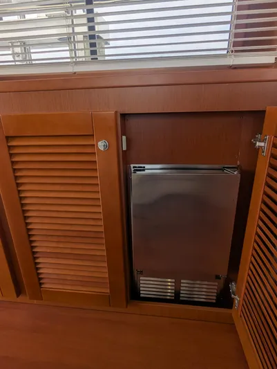  Yacht Photos Pics Wooden cabinet with stainless steel appliance on Beneteau Swift Trawler 44, 2019 model.