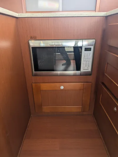  Yacht Photos Pics Microwave in 2019 Beneteau Swift Trawler 44 kitchen with wooden cabinetry.