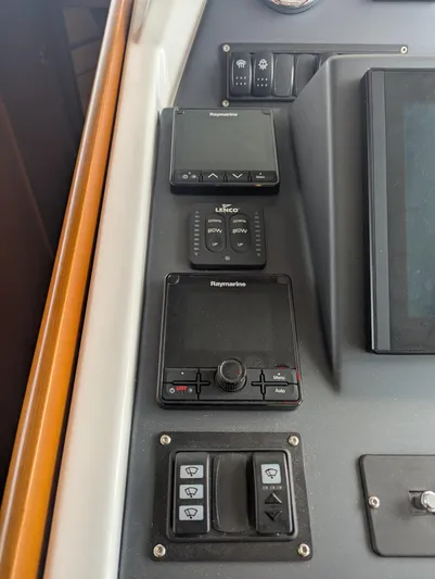  Yacht Photos Pics Control panel of 2019 Beneteau Swift Trawler 44 with Raymarine and Lenco systems.