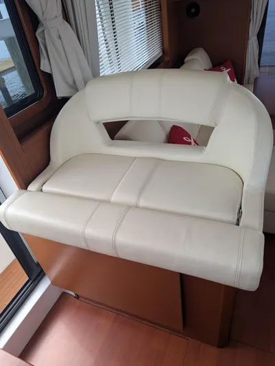  Yacht Photos Pics Interior seating of 2019 Beneteau Swift Trawler 44, featuring cream leather upholstery.