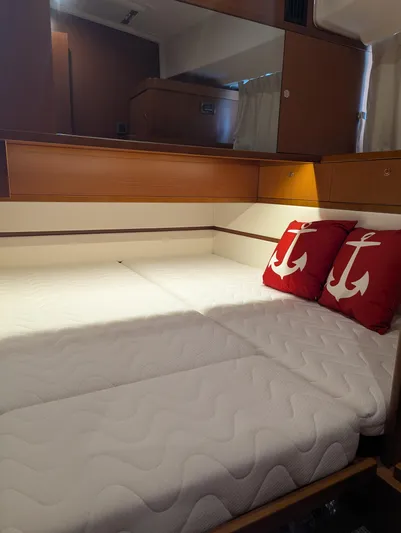  Yacht Photos Pics 2019 Beneteau Swift Trawler 44 cabin with twin beds and anchor-themed pillows.