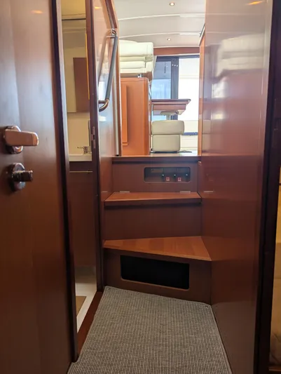  Yacht Photos Pics Interior view of 2019 Beneteau Swift Trawler 44, featuring wooden stairs and modern design.