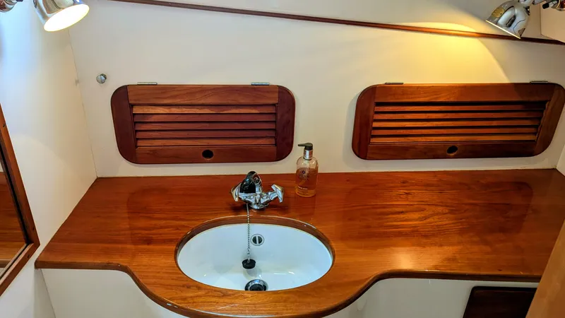 Luna Yacht Photos Pics Hinckley Picnic Boat 2000 interior with wooden countertop and sink.