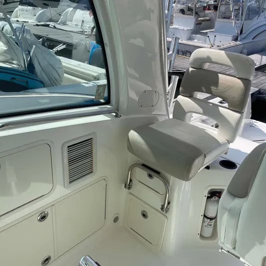 Reel Inspired Yacht Photos Pics Interior of a 2009 Boston Whaler 345 Conquest boat with seating and storage.