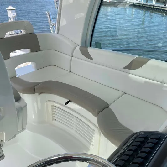 Reel Inspired Yacht Photos Pics 2009 Boston Whaler 345 Conquest interior seating with waterfront view.