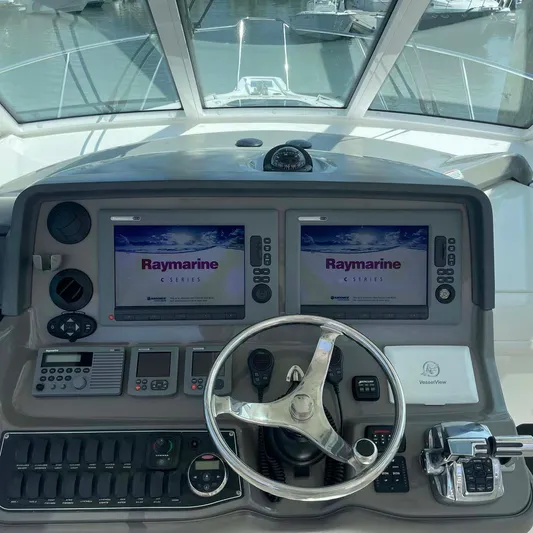 Reel Inspired Yacht Photos Pics 2009 Boston Whaler 345 Conquest helm with Raymarine displays and steering wheel.