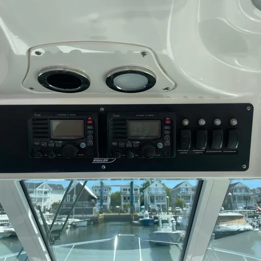 Reel Inspired Yacht Photos Pics 2009 Boston Whaler 345 Conquest dashboard with control panel and marine electronics.