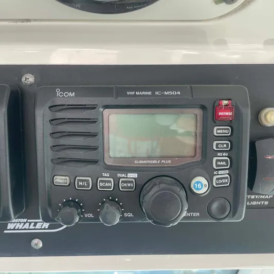 Reel Inspired Yacht Photos Pics VHF marine radio on 2009 Boston Whaler 345 Conquest dashboard.