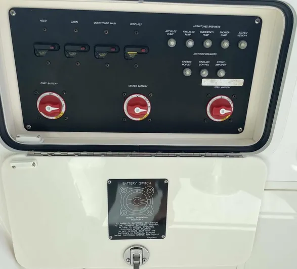Reel Inspired Yacht Photos Pics Control panel of a 2009 Boston Whaler 345 Conquest boat, featuring battery switches.