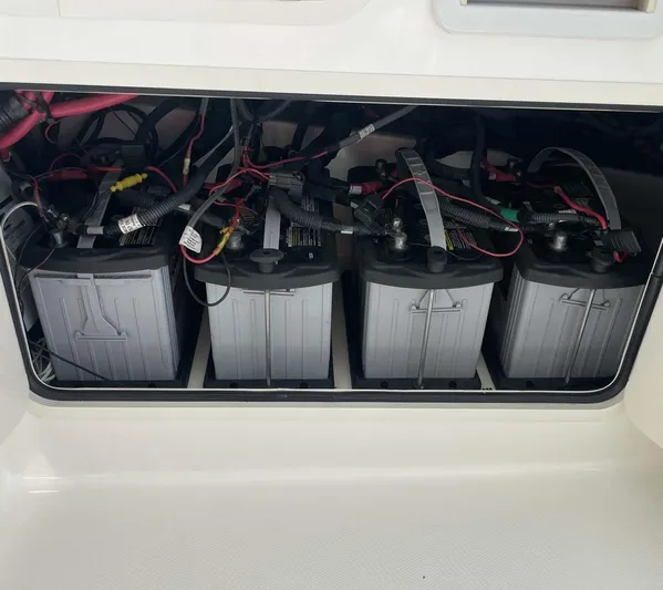 Reel Inspired Yacht Photos Pics Battery compartment of a 2009 Boston Whaler 345 Conquest boat, showing four batteries.