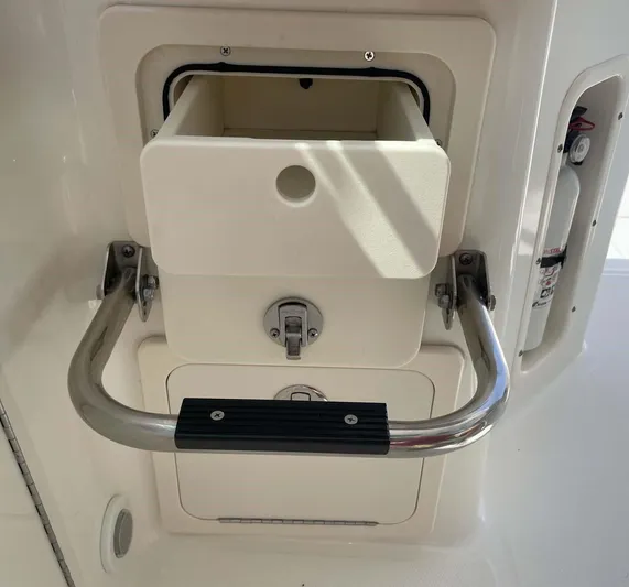 Reel Inspired Yacht Photos Pics 2009 Boston Whaler 345 Conquest storage compartment with handle and latch.