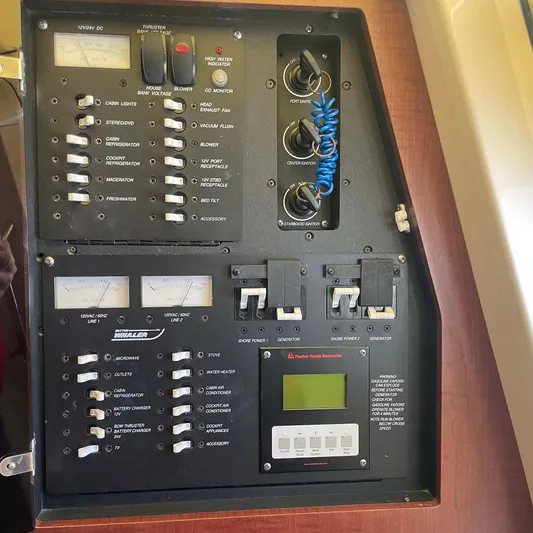 Reel Inspired Yacht Photos Pics Control panel of a 2009 Boston Whaler 345 Conquest boat with switches and gauges.