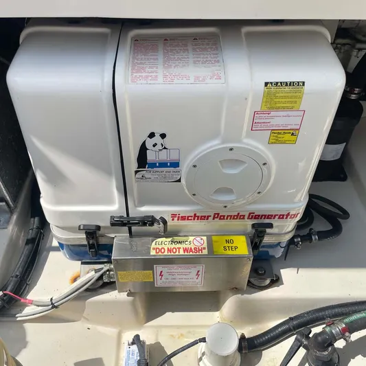 Reel Inspired Yacht Photos Pics Fischer Panda generator on 2009 Boston Whaler 345 Conquest boat, labeled "Do Not Wash."