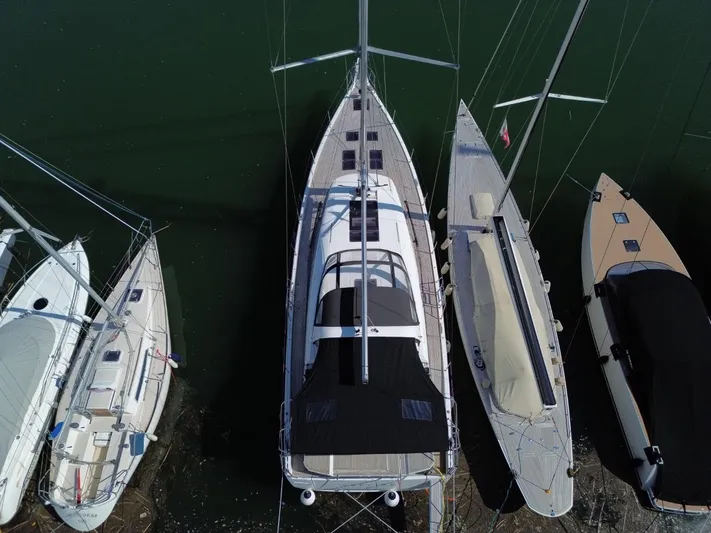 Yachting Conseil Yacht Photos Pics Aerial view of 2023 Jeanneau 60 yacht docked among other sailboats.