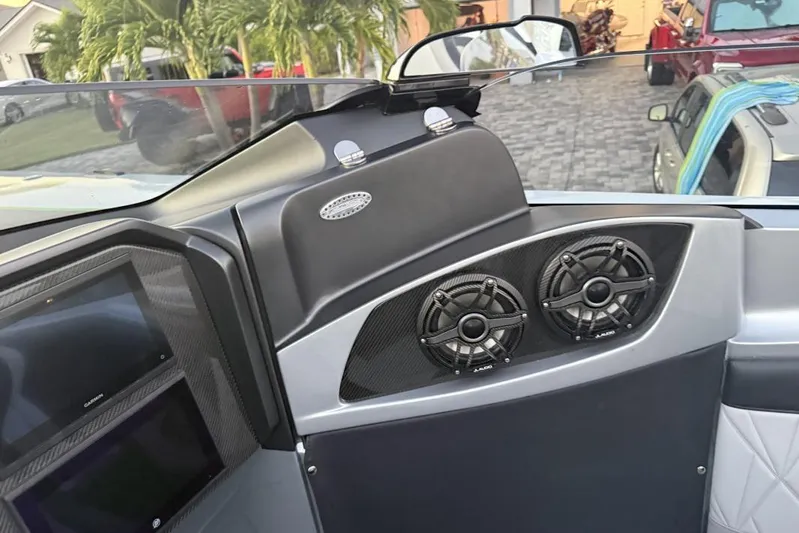  Yacht Photos Pics Interior of 2026 Nor-Tech 4000 Roadster with dual speakers and sleek dashboard design.