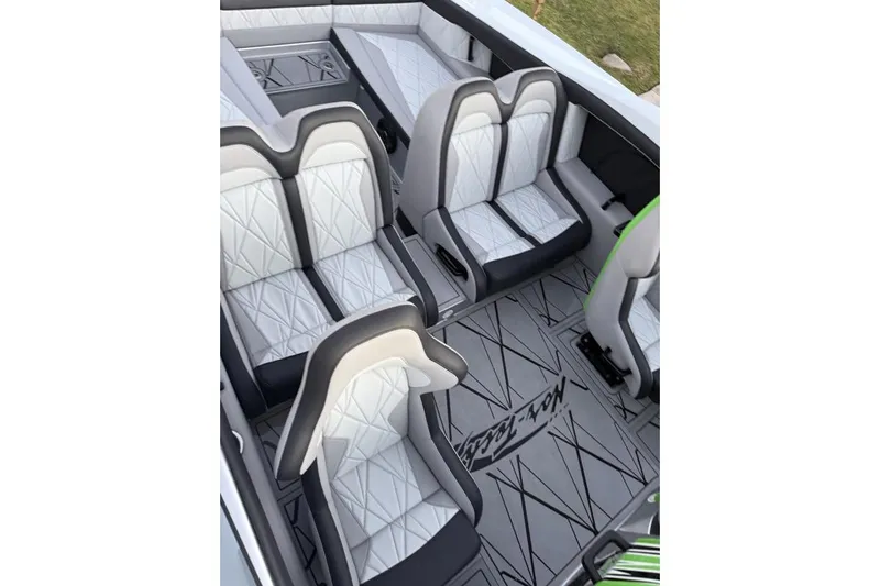  Yacht Photos Pics Luxurious interior of 2026 Nor-Tech 4000 Roadster with stylish white and gray seating.