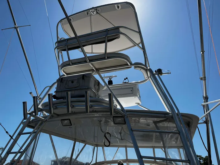 The Boo Factor Yacht Photos Pics 2003 Ocean 40 Super Sport boat tower against clear blue sky.