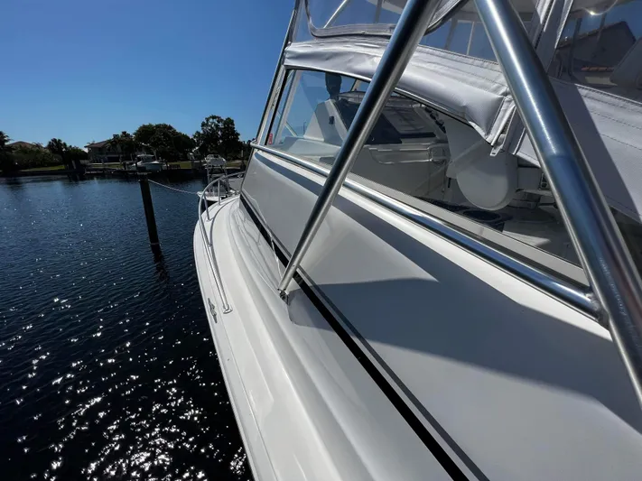 The Boo Factor Yacht Photos Pics 2003 Ocean 40 Super Sport yacht docked on a sunny day.