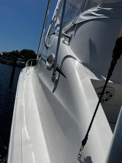 The Boo Factor Yacht Photos Pics 2003 Ocean 40 Super Sport yacht side view, featuring sleek white design and chrome details.