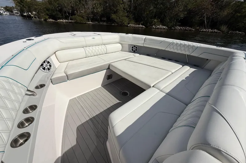  Yacht Photos Pics Luxurious seating area on 2020 Regal 38 SAV boat, featuring elegant white upholstery.