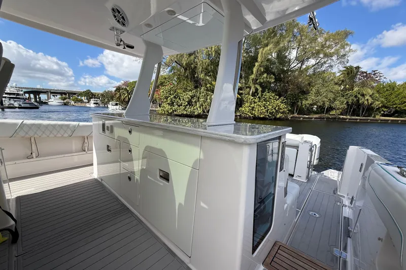  Yacht Photos Pics 2020 Regal 38 SAV yacht interior with sleek cabinetry and scenic waterfront view.