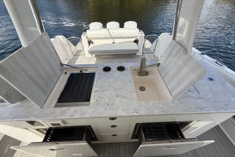  Yacht Photos Pics Luxury 2020 Regal 38 SAV yacht with outdoor kitchen and seating area.