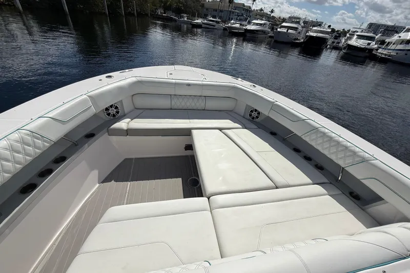  Yacht Photos Pics Luxurious seating area on a 2020 Regal 38 SAV boat, docked at a marina.