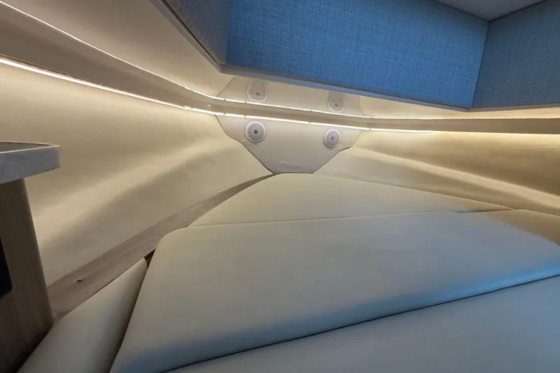  Yacht Photos Pics Interior cabin of 2020 Regal 38 SAV boat with modern lighting and seating.