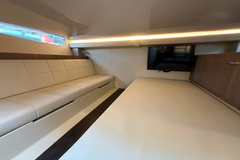 Yacht Photos Pics Luxurious interior of 2020 Regal 38 SAV yacht with modern seating and TV.