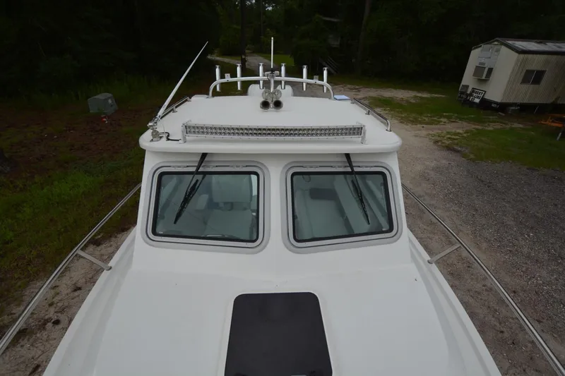 Still Yacht Photos Pics Parker 2420 boat, 2025 model, top view showing cabin and deck details.