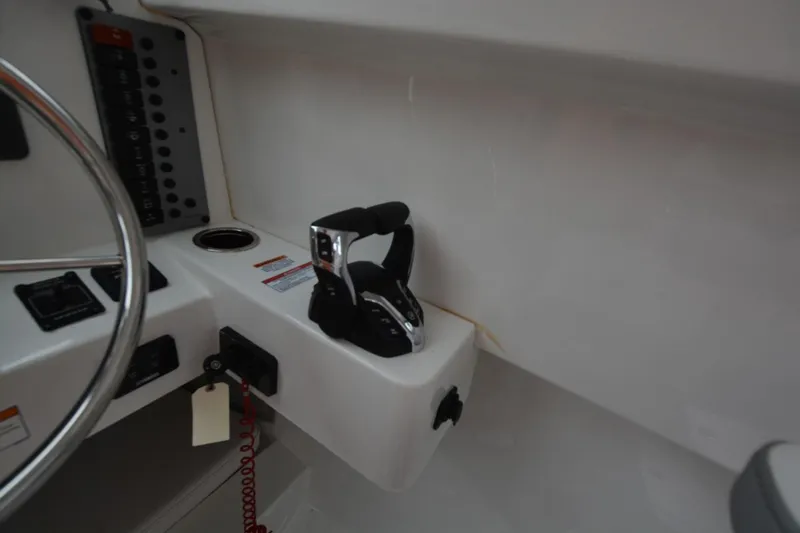 Still Yacht Photos Pics Control panel and throttle of 2025 Parker 2420 boat cockpit.