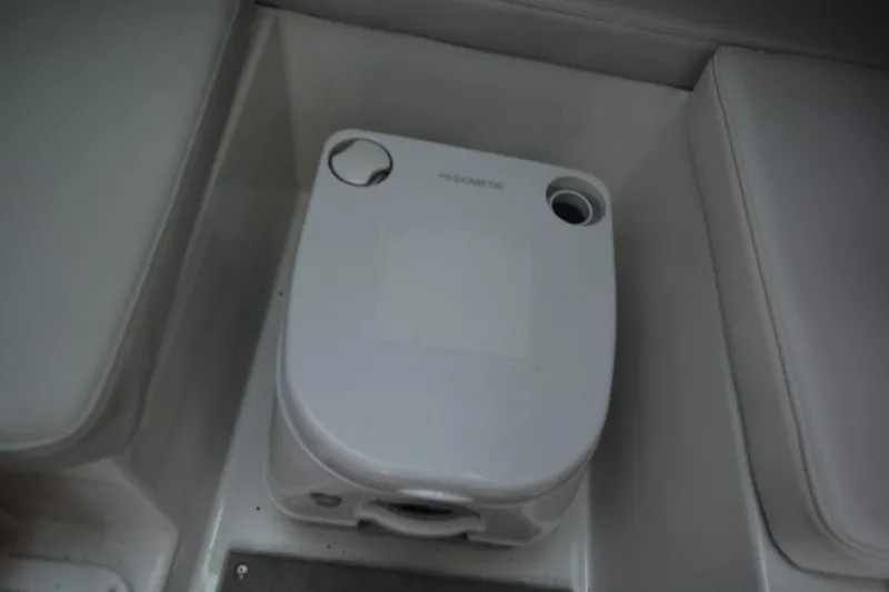 Still Yacht Photos Pics Portable toilet in Parker 2420 boat, 2025 model, with compact design and white finish.