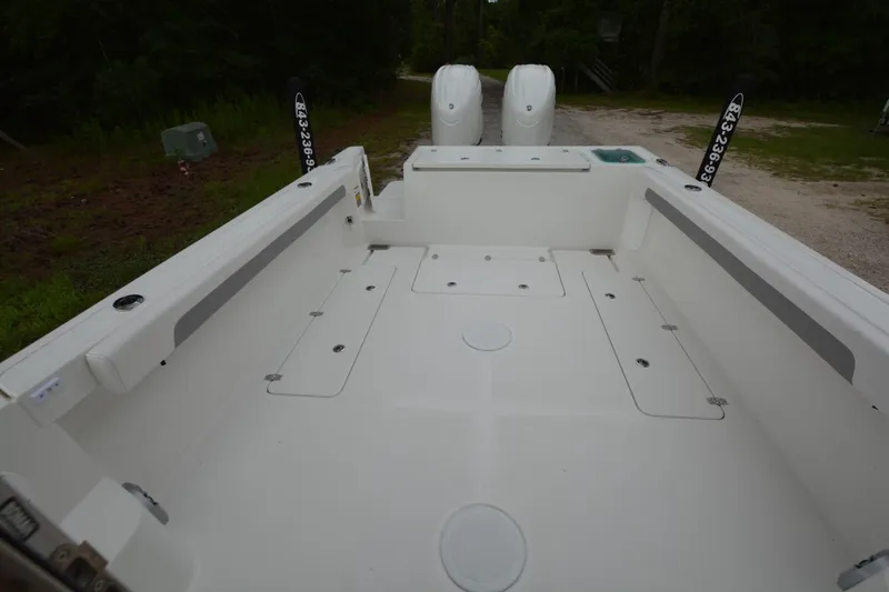 Still Yacht Photos Pics 2025 Parker 2420 boat interior with spacious deck and dual engines.